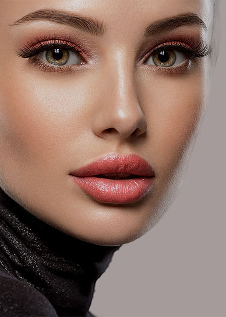 Portrait of beautiful young woman with bright pink makeup Beaut