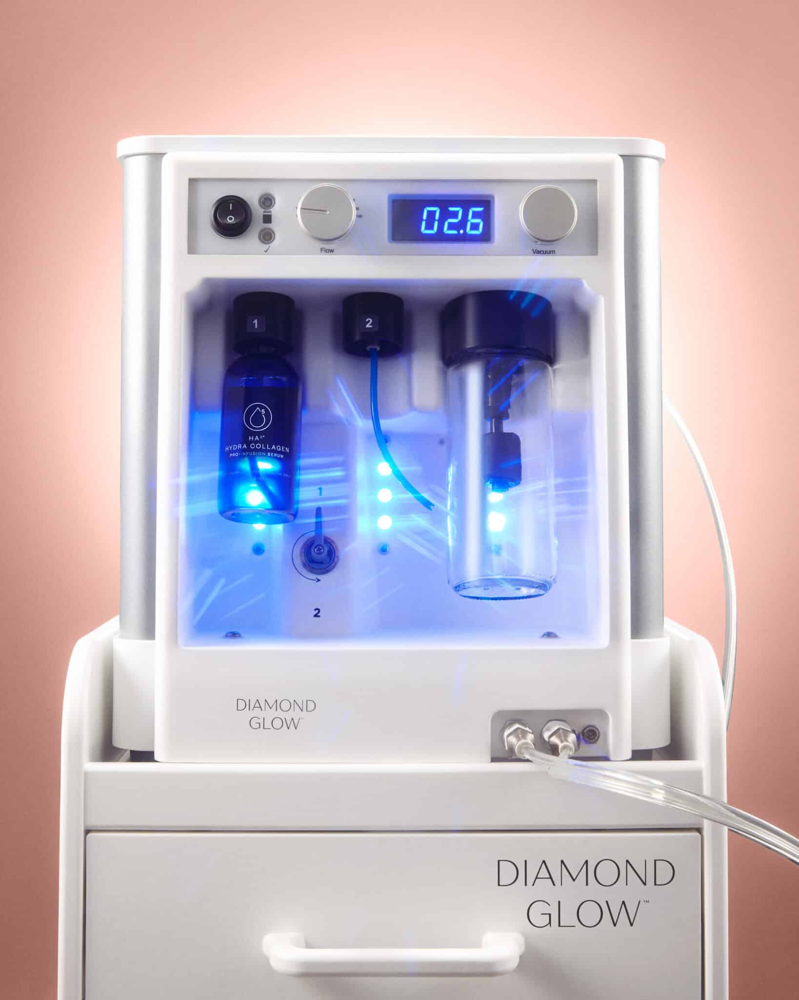DiamondGlow device with diamond-tipped handpiece and SkinMedica Pro-Infusion serum cartridges